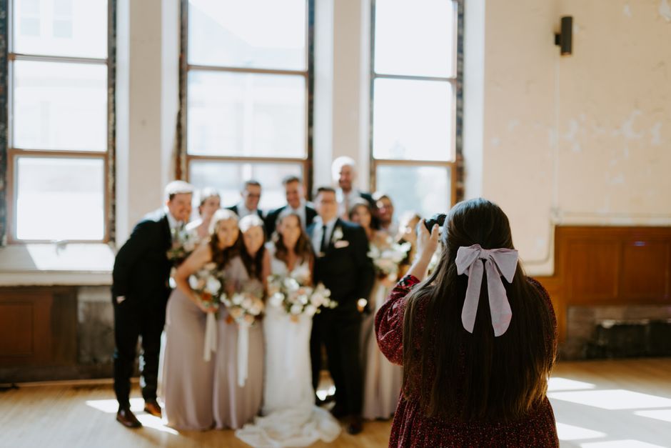 Professional wedding photographer taking a photo of a couple