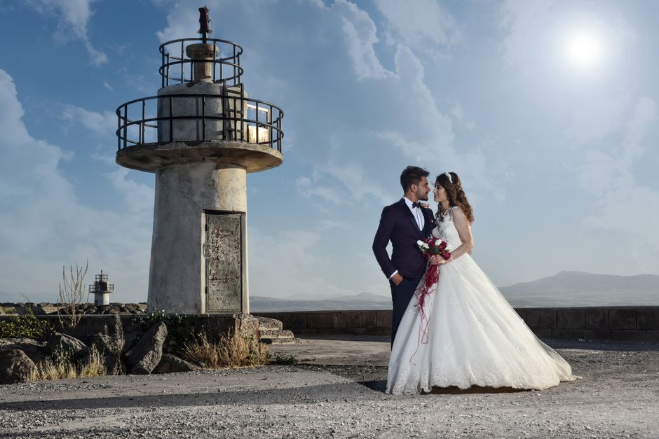 Wedding couple outdoors sharing a romantic moment